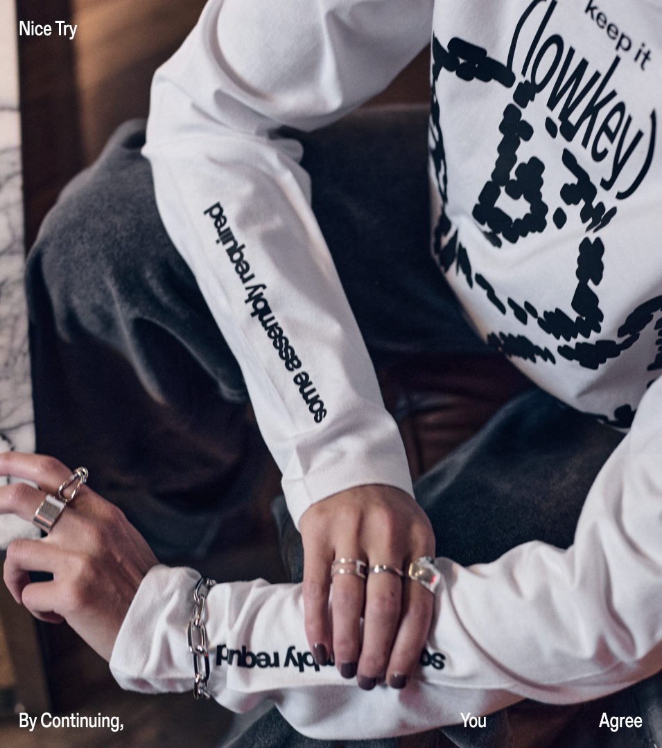 Graphic of a typography specimen showing the alphabet and numerals on top of a dark gray background.